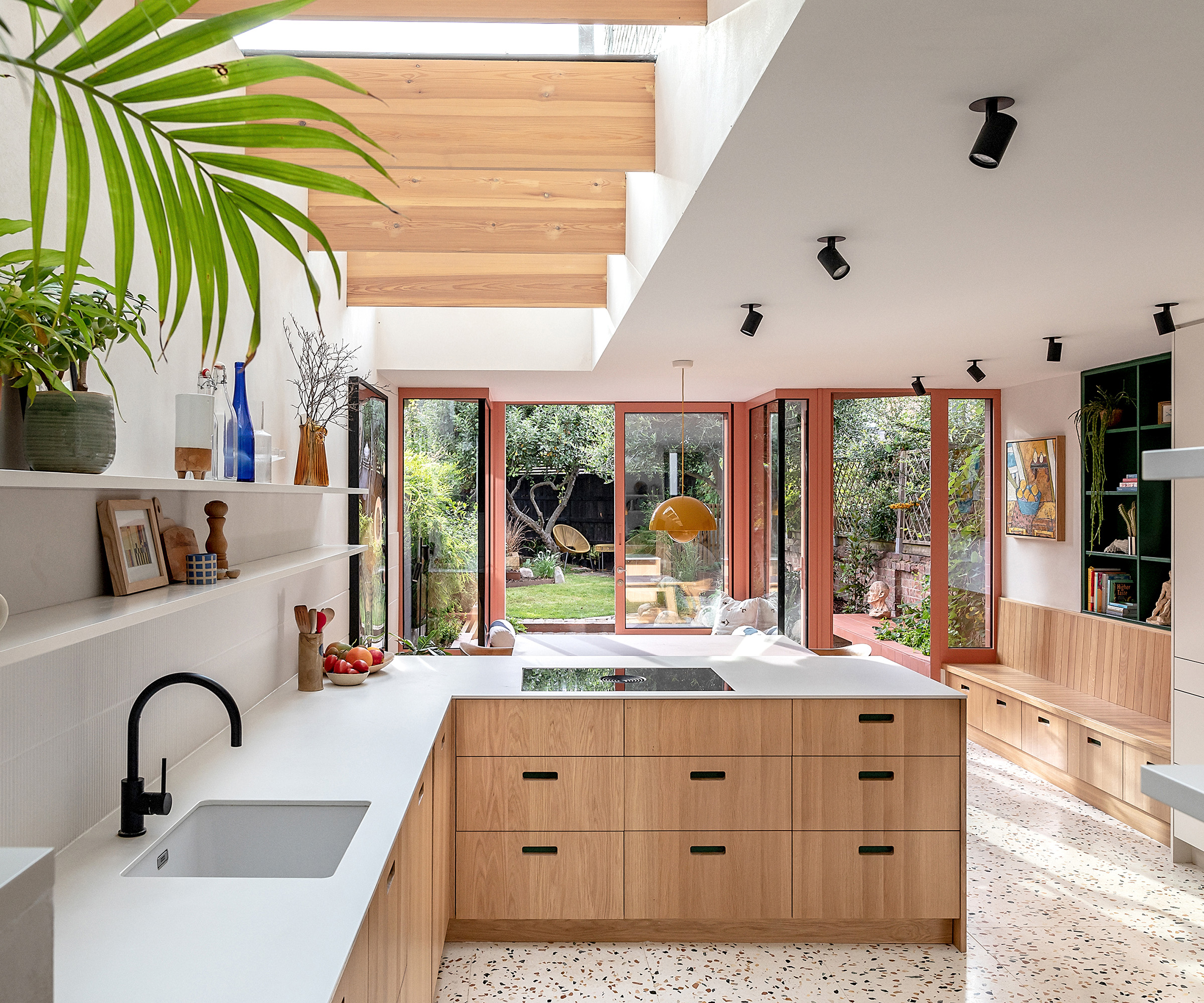 The interior kitchen extension of a London terrace house with bifold doors